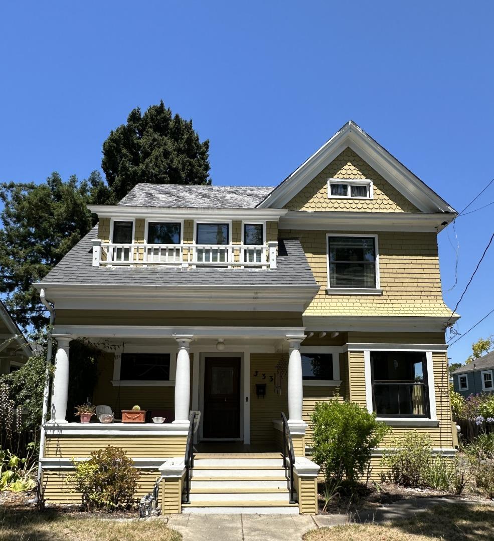 a front view of a house with yard