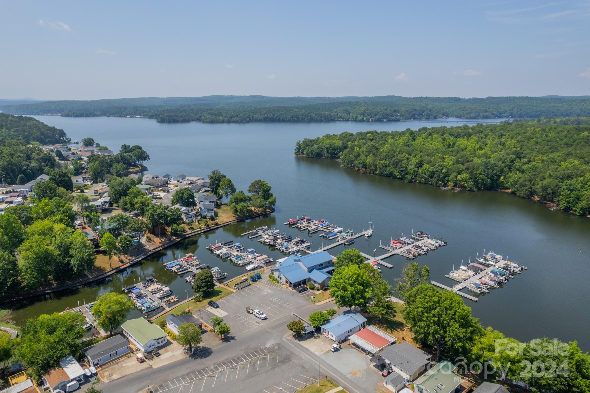 an aerial view of a house with a lake view