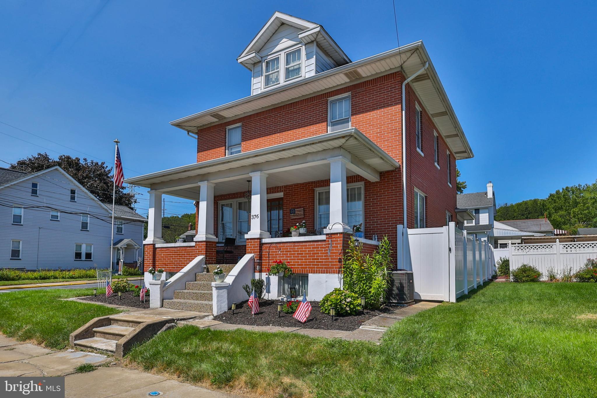 front view of a house with a yard