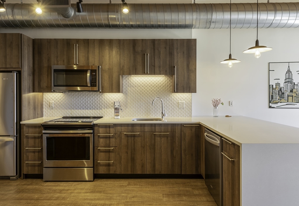 a kitchen with a stove and a microwave