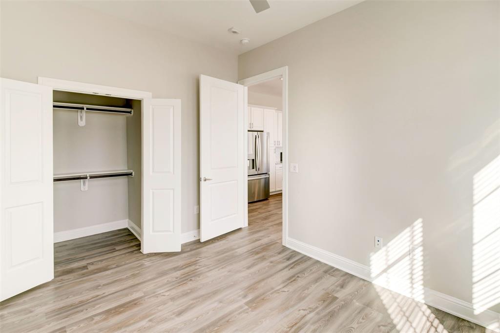 a view of hallway with wooden floor