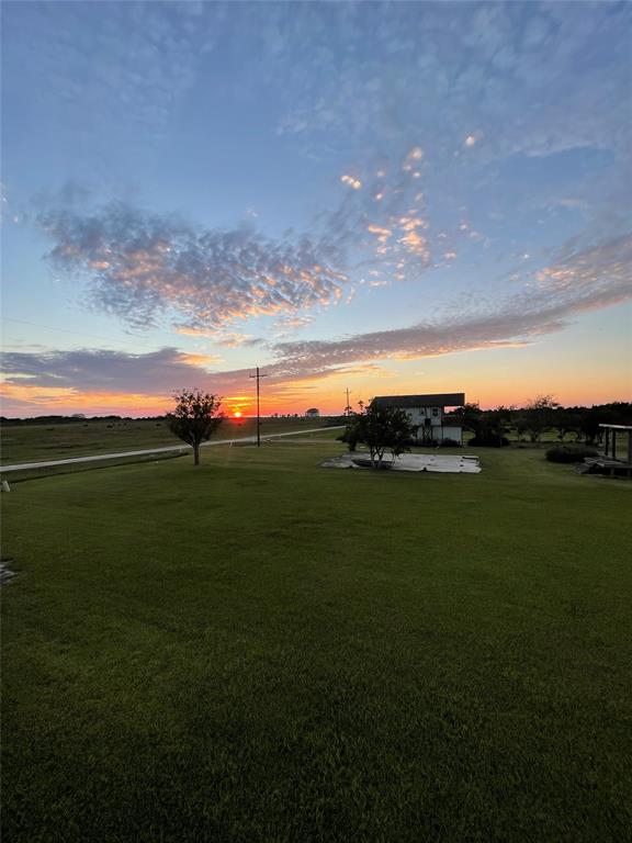 a view of an ocean and yard