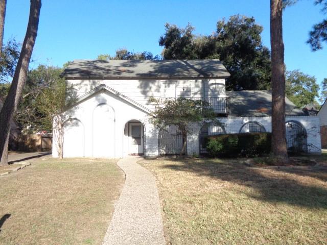 a view of a house with a snow in the yard