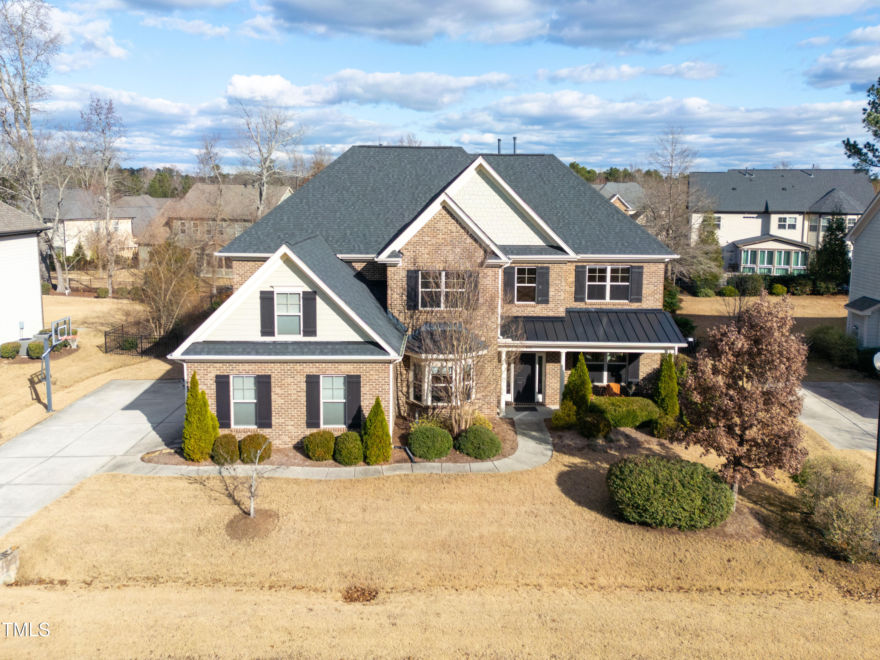 front view of a house with a yard