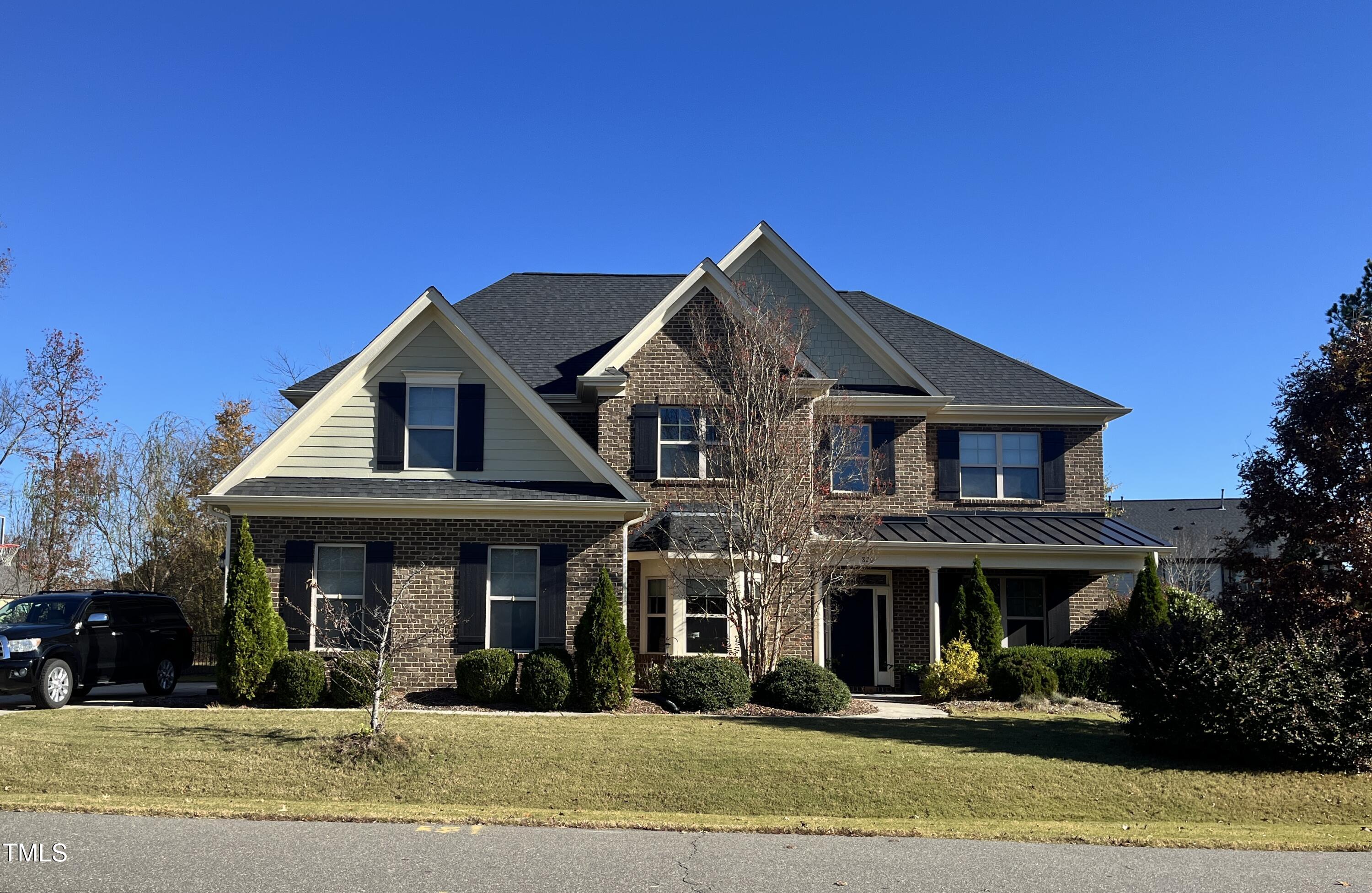 a front view of a house with a porch