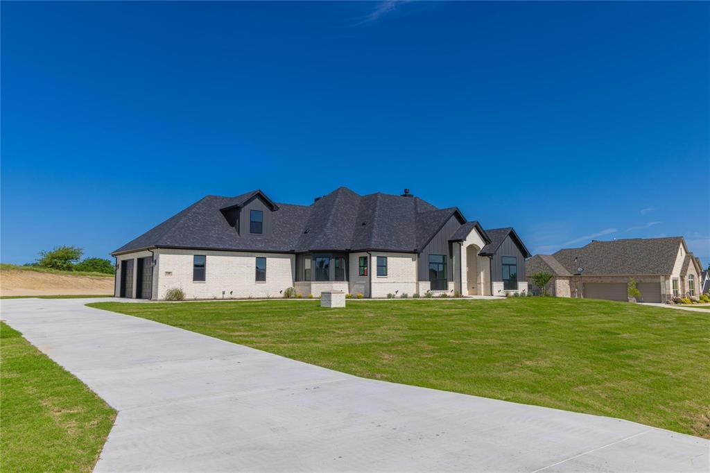 a view of a house with a big yard