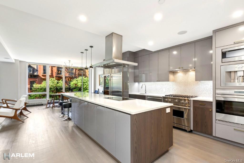 a kitchen with a stove a sink and a refrigerator