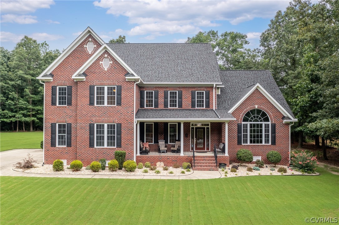 front view of a house with a yard