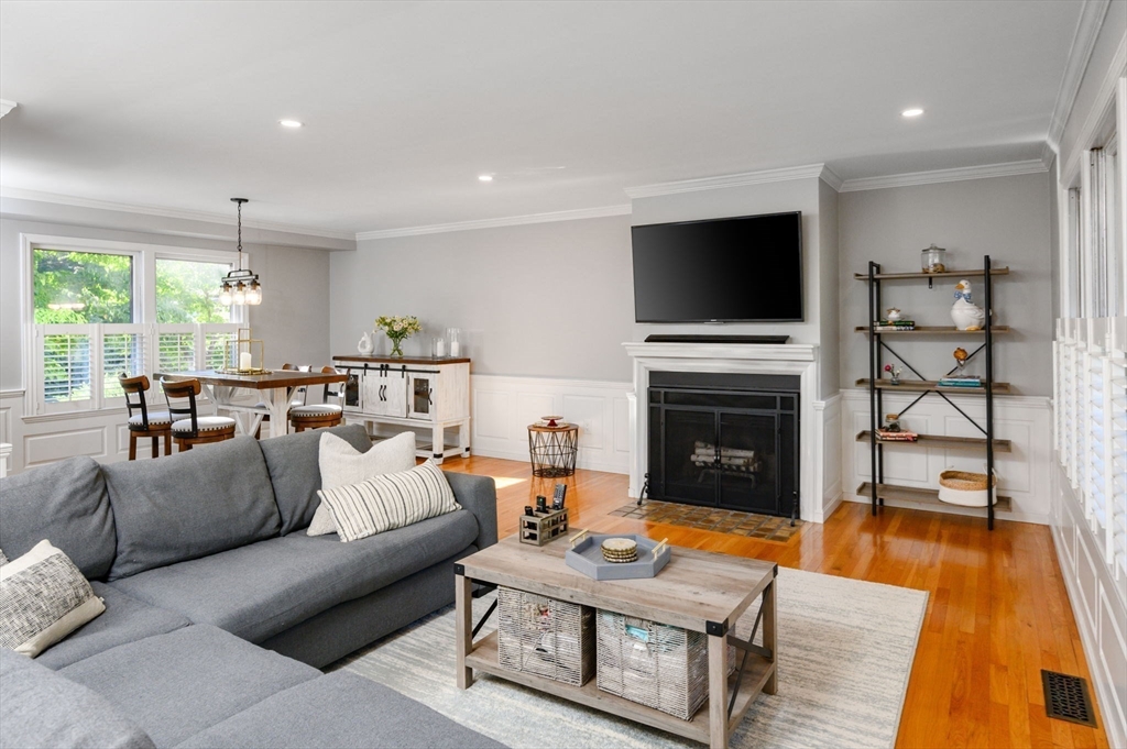 a living room with furniture fireplace and flat screen tv