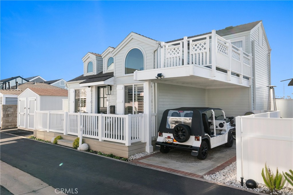 a view of a car park in front of house