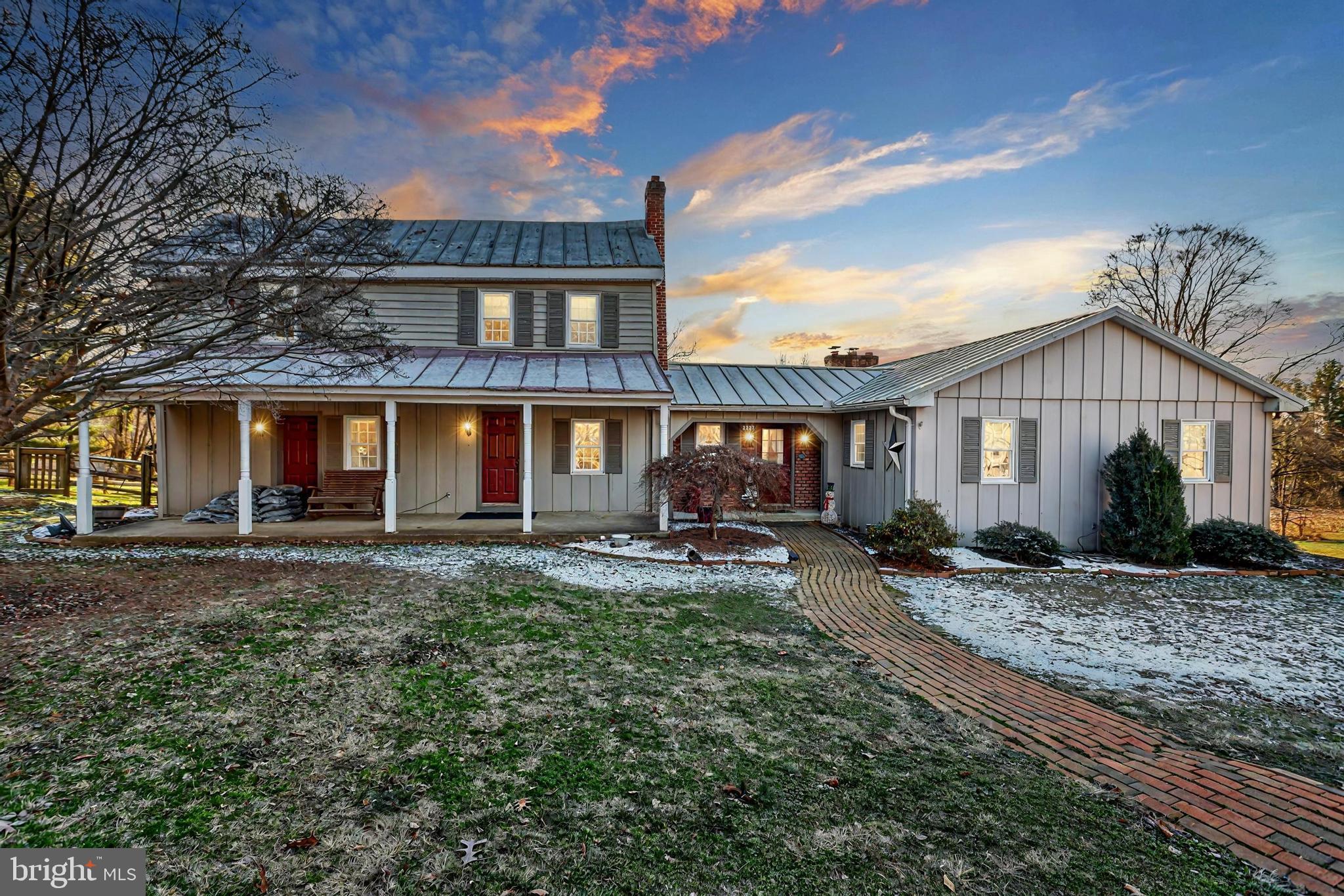 a front view of a house with yard patio and fire pit