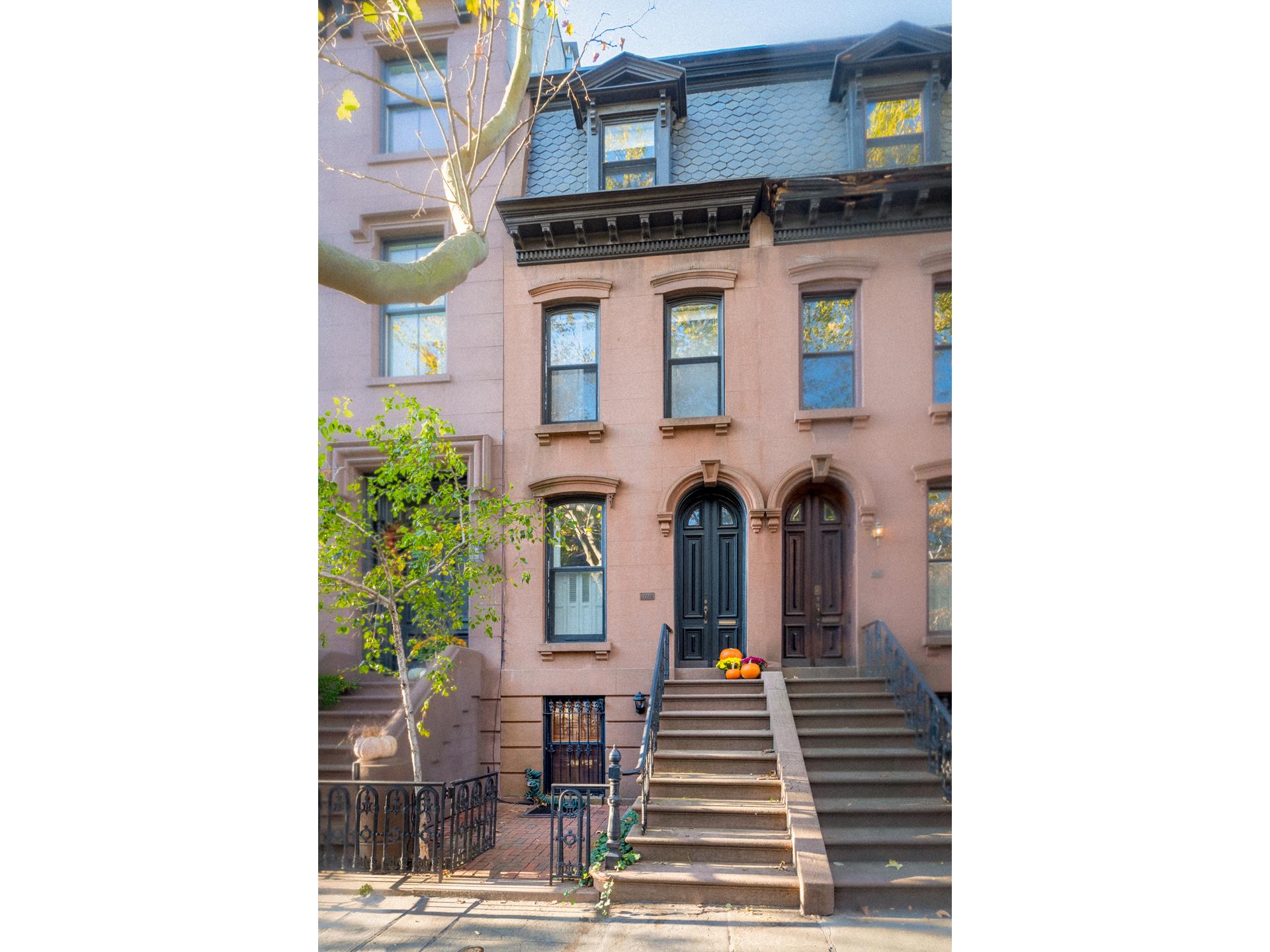 a front view of a house with many windows