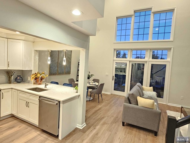 a living room with furniture and a book shelf