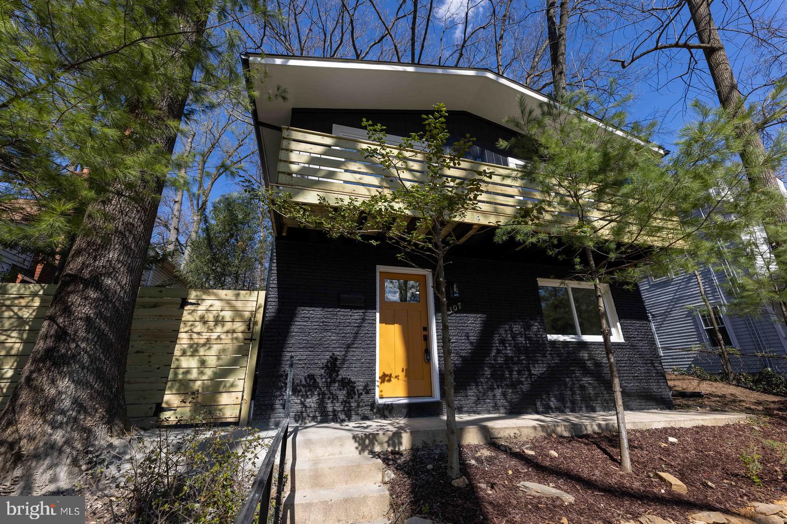 a view of a house with a tree