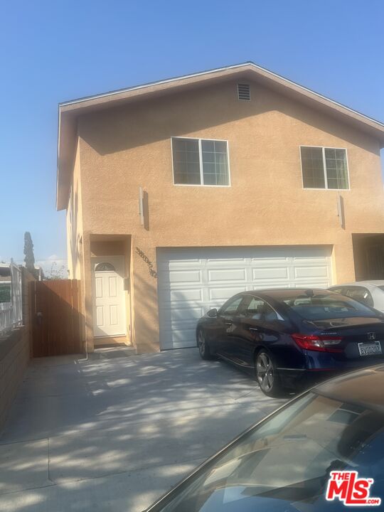 a front view of a house with parking