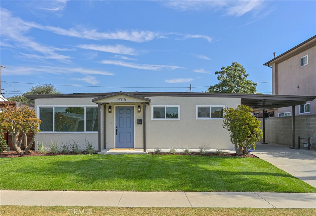 front view of a house with a yard