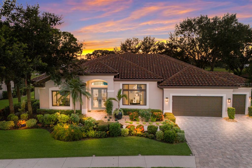 Stunning home with landscape lighting and west facing lanai