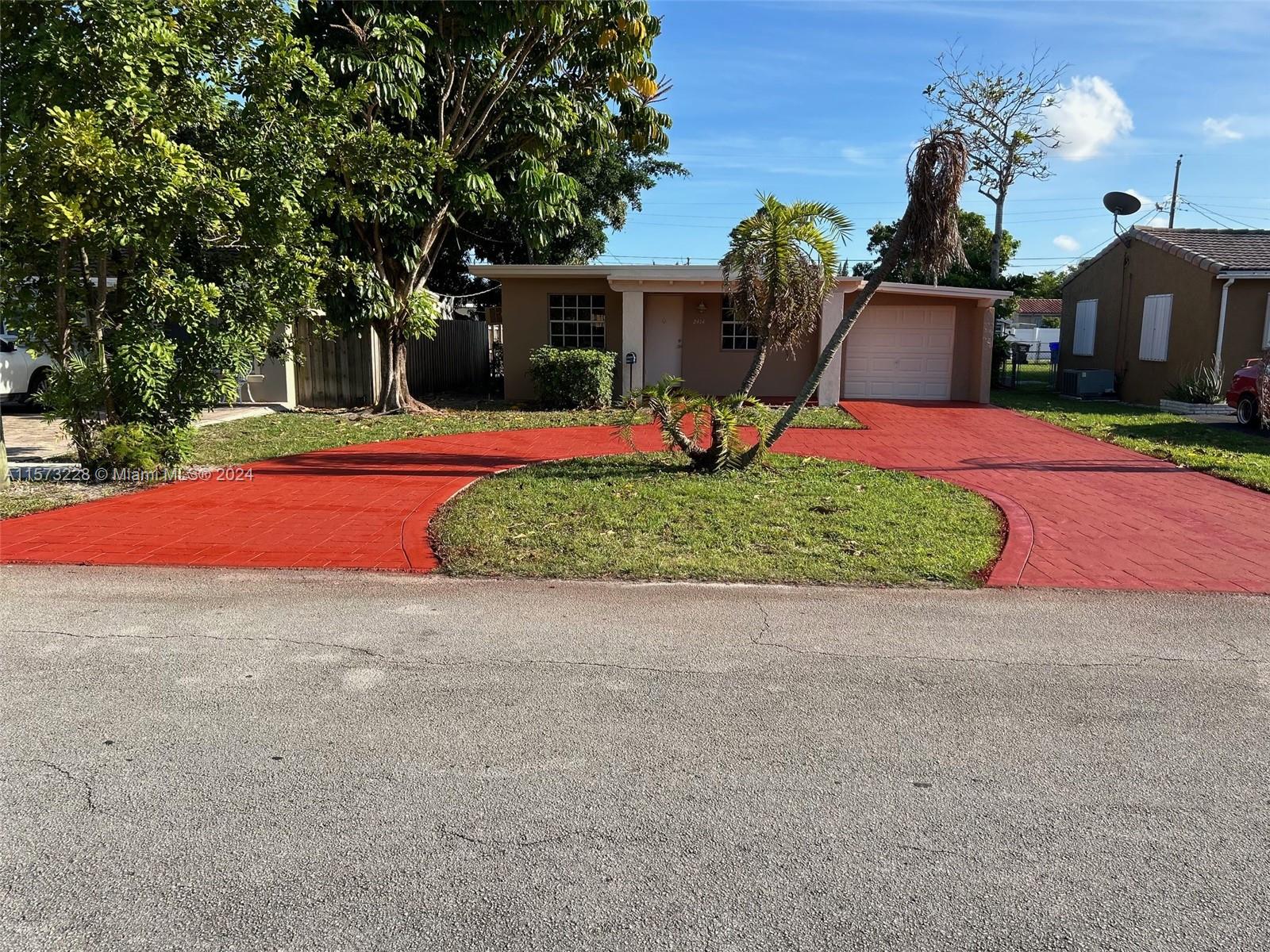 a front view of a house with yard