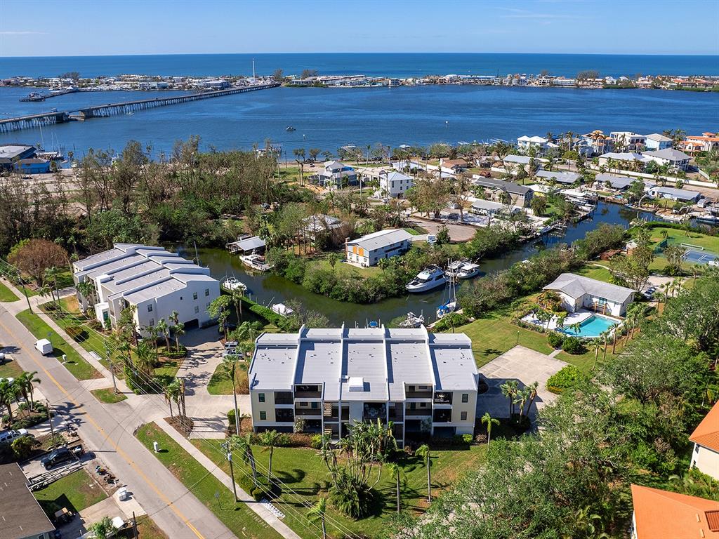 an aerial view of a house with a lake view