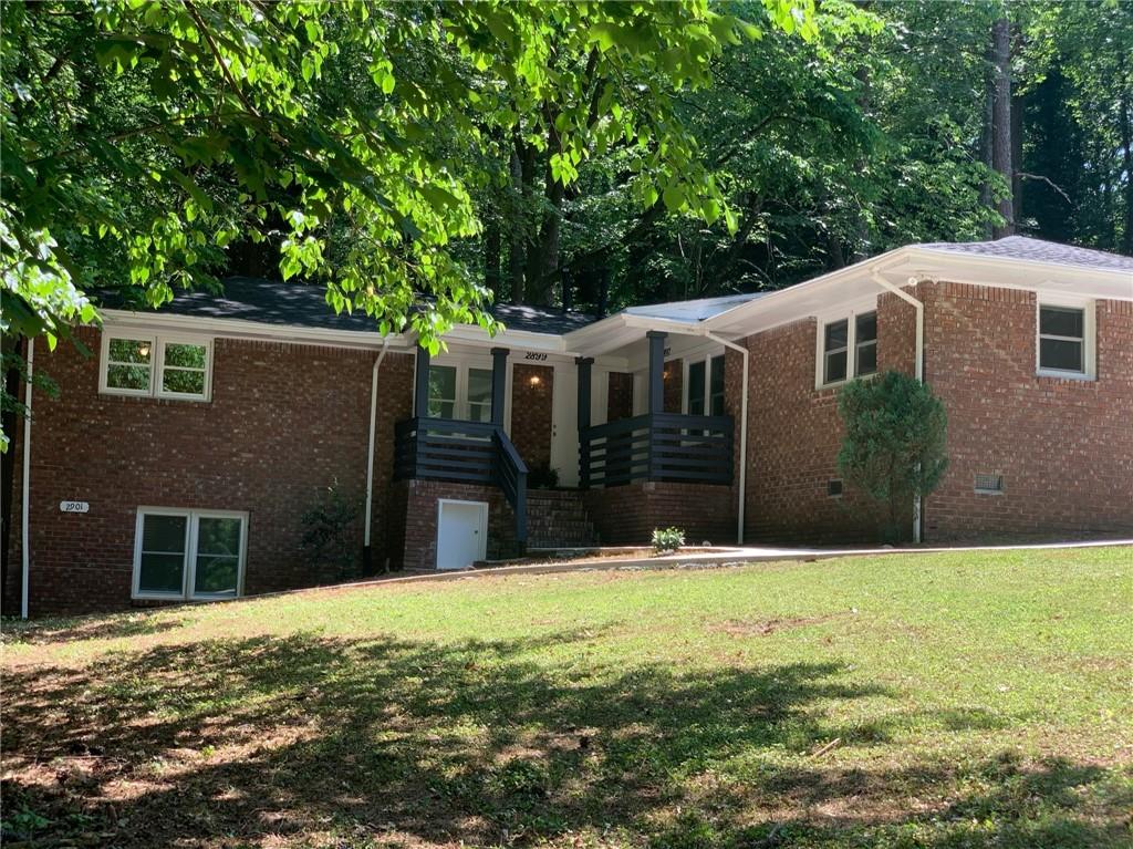 a front view of a house with a yard