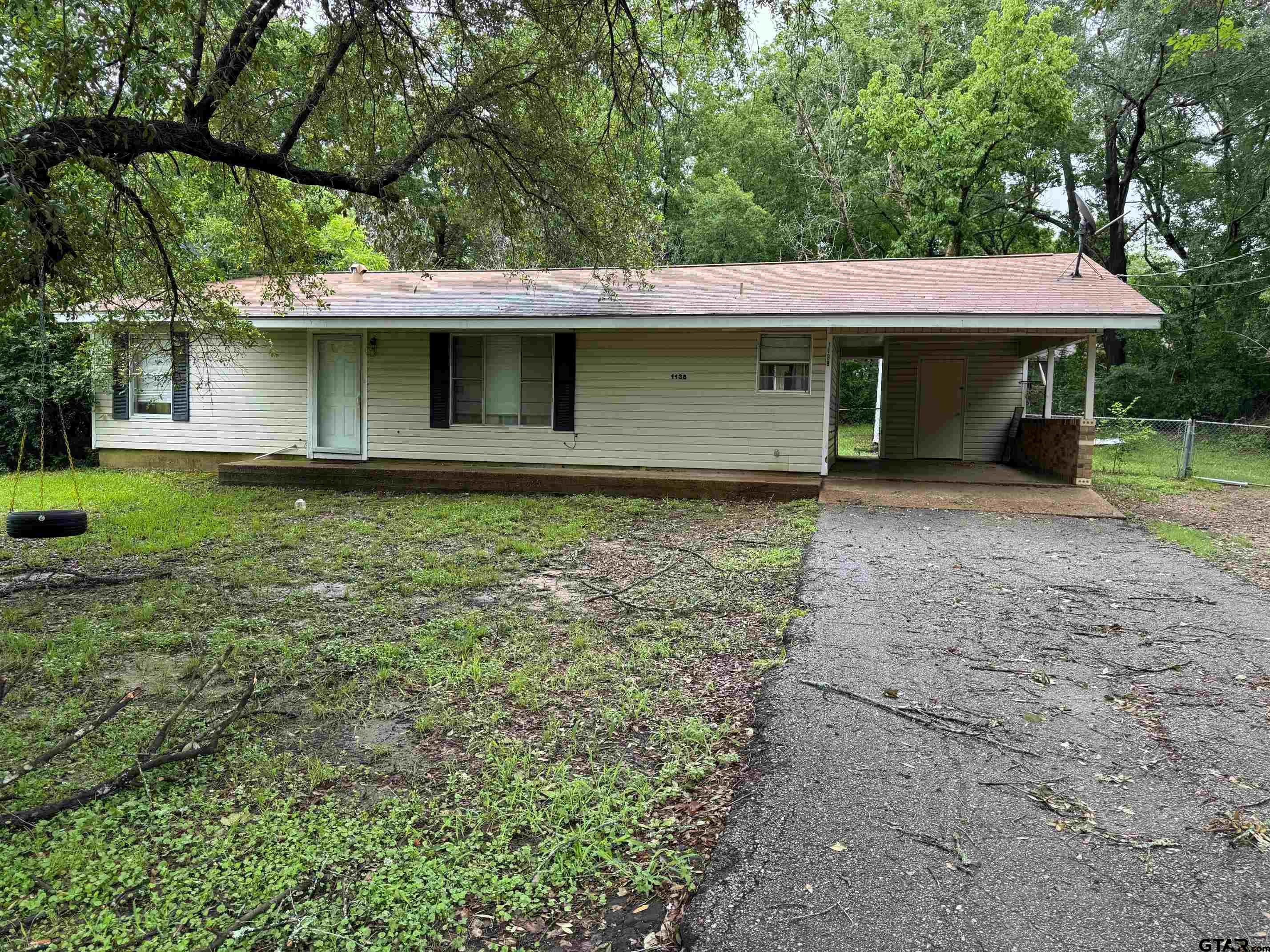 a view of a house with a yard