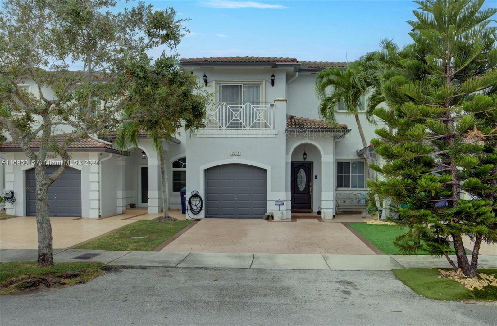 a front view of a house with yard