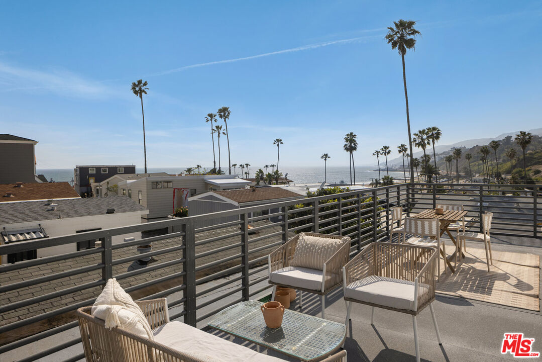 a view of a chairs and table in the terrace