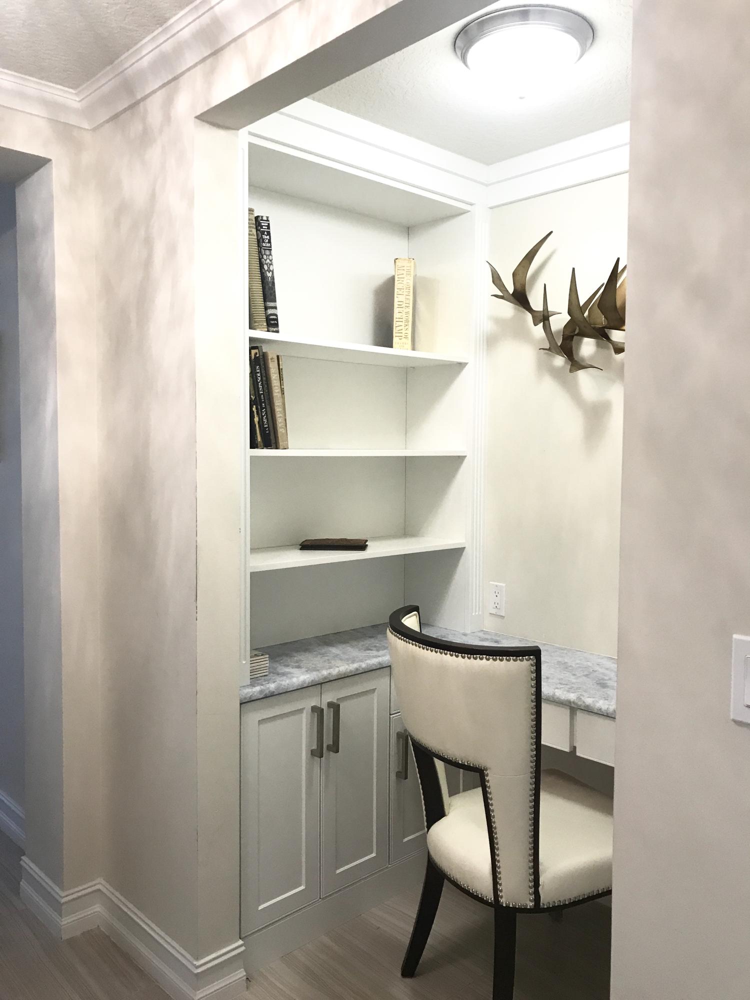 a view of a chair and table in a room