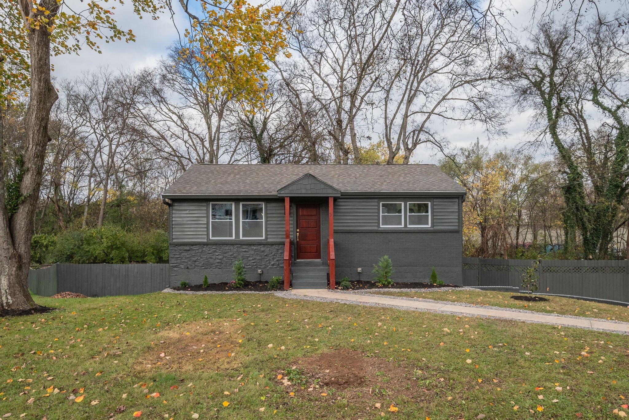 a front view of a house with a yard