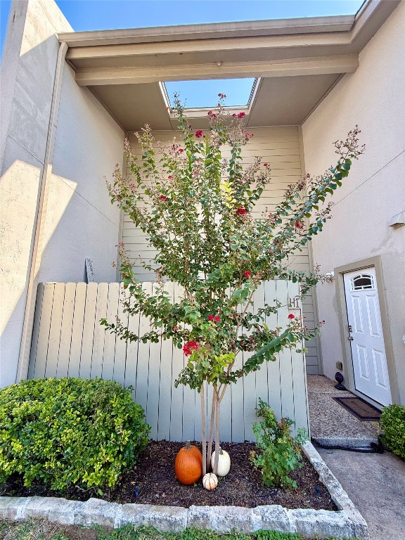 a front view of a house with a yard and flowers