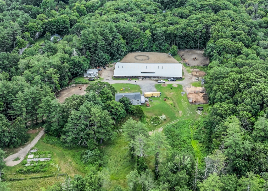 an aerial view of a house with yard swimming pool and outdoor seating