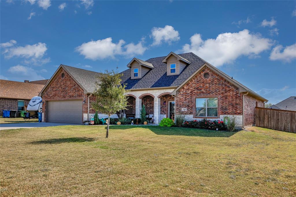 a view of a house next to a big yard