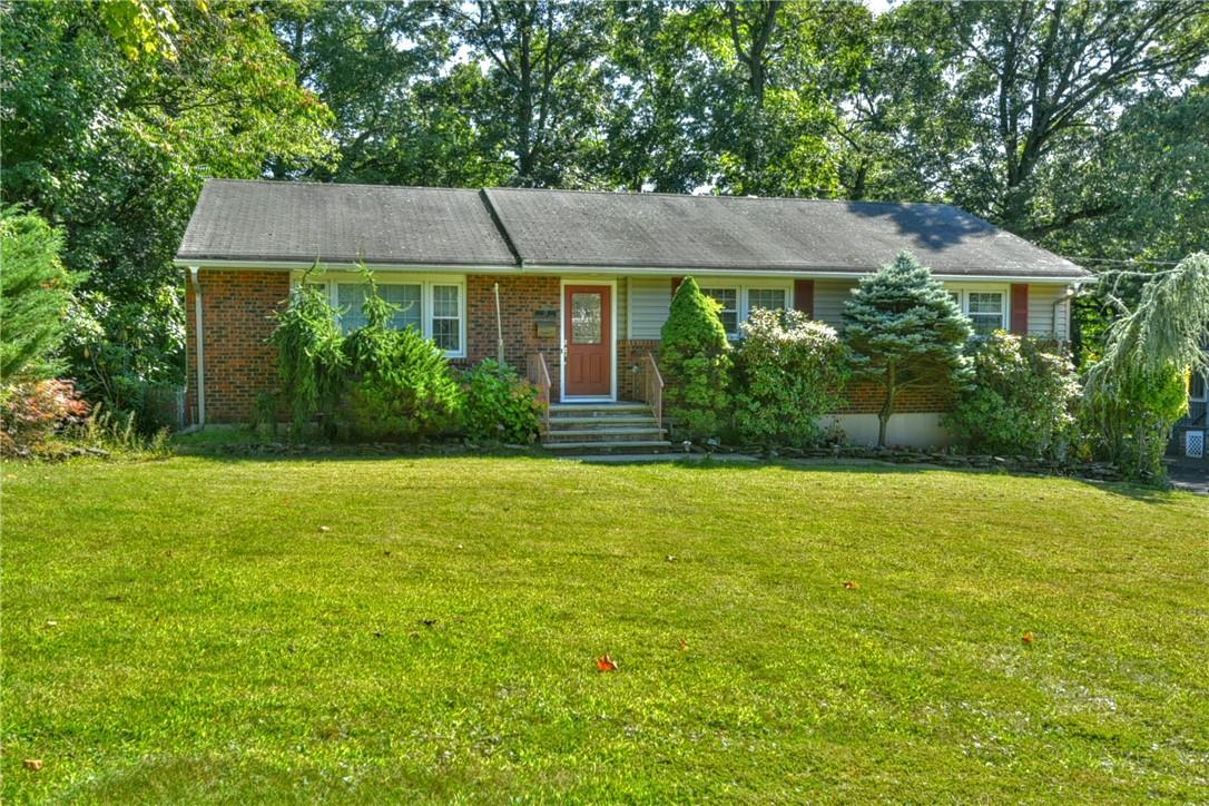 Single story home with a front yard