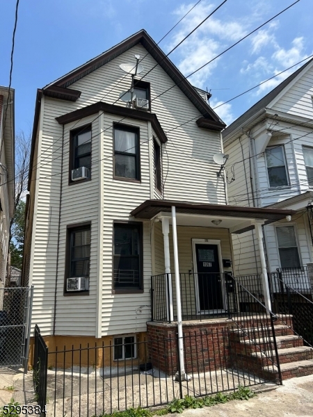 a view of a house with large windows