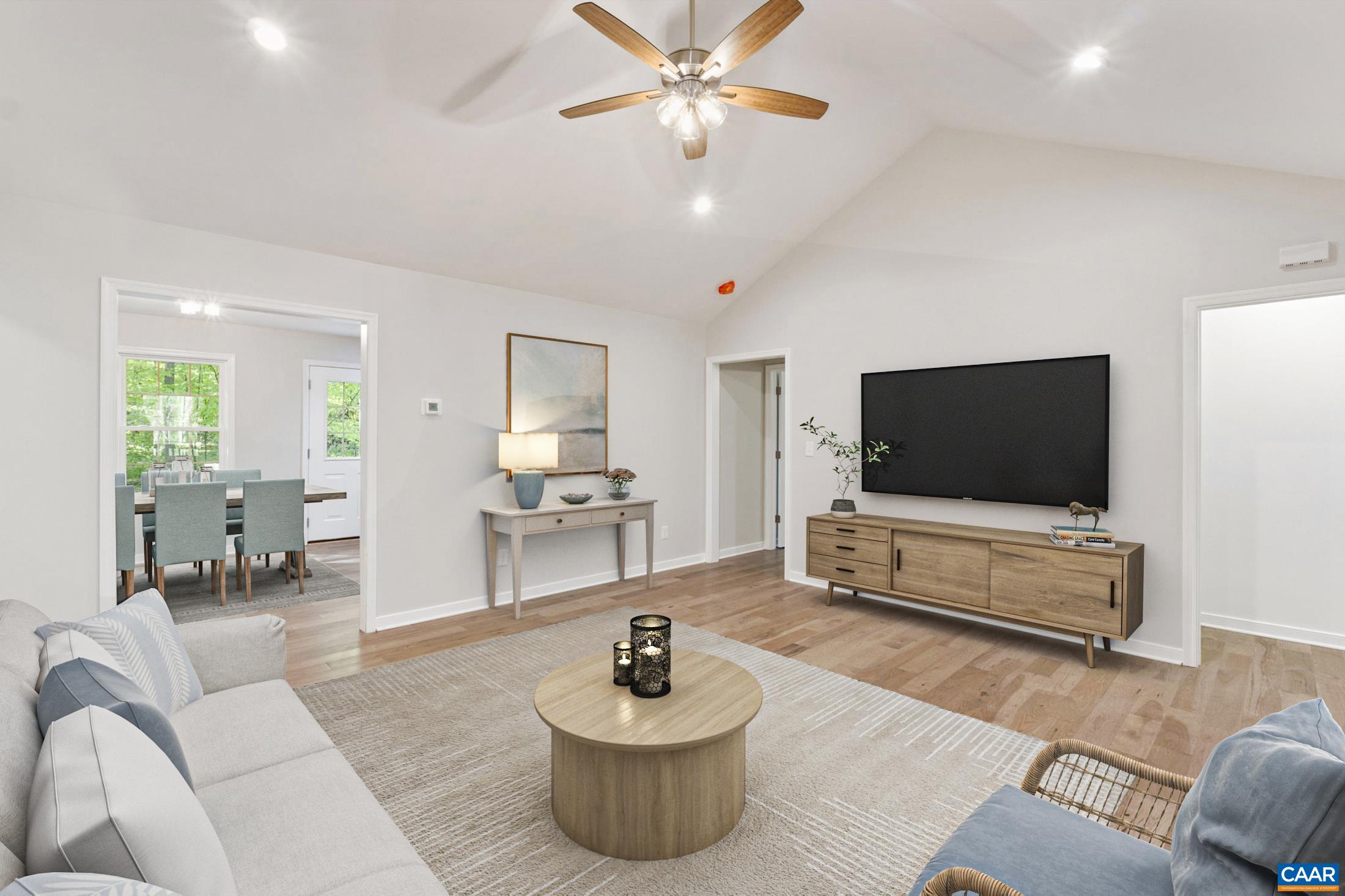 a living room with furniture and a flat screen tv