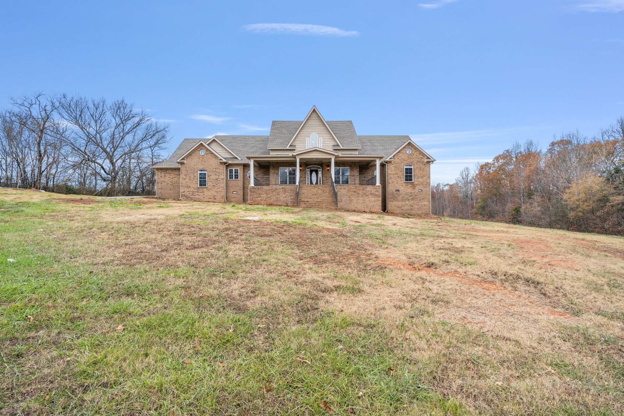 a front view of a house with a yard