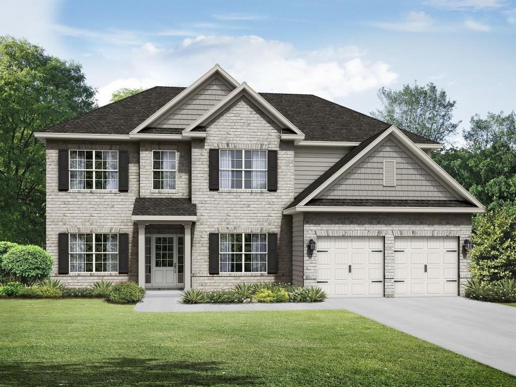 a front view of a house with a yard and garage