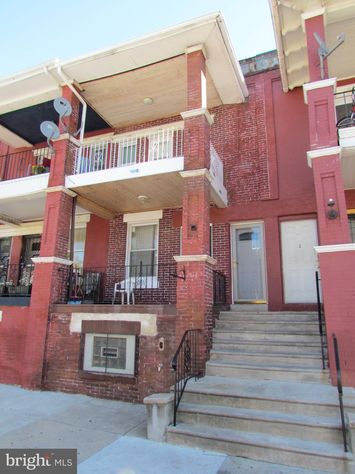 a view of a building with a porch