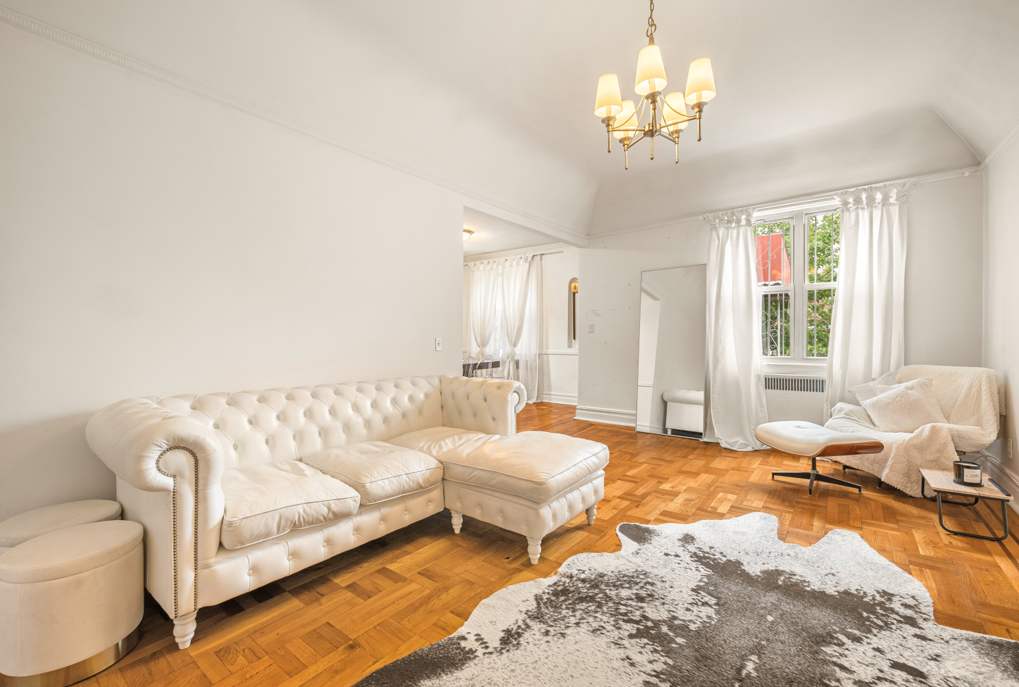 a spacious bedroom with a bed and window