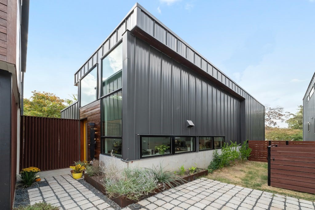 a front view of a house with garden