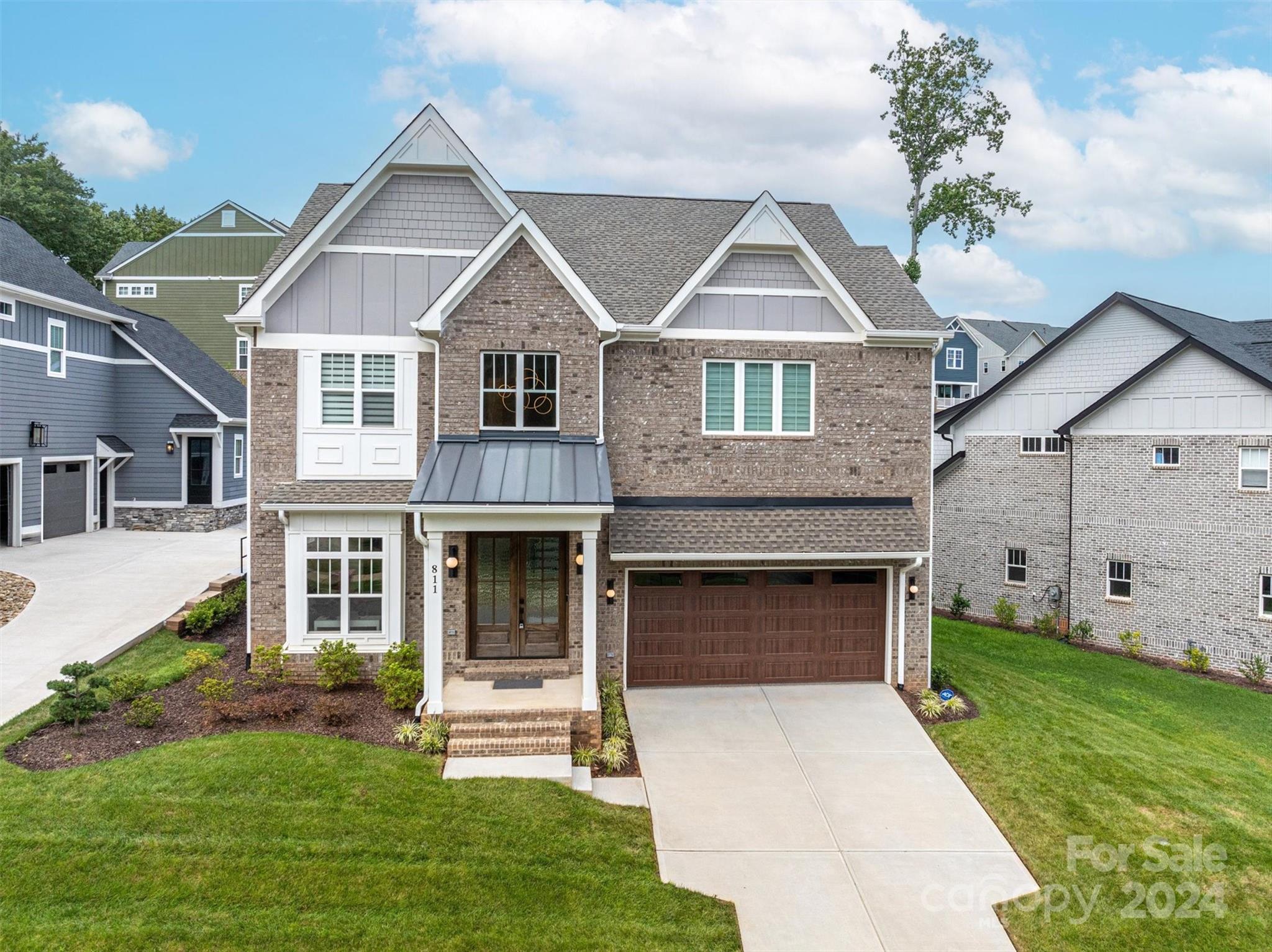 a front view of a house with a yard