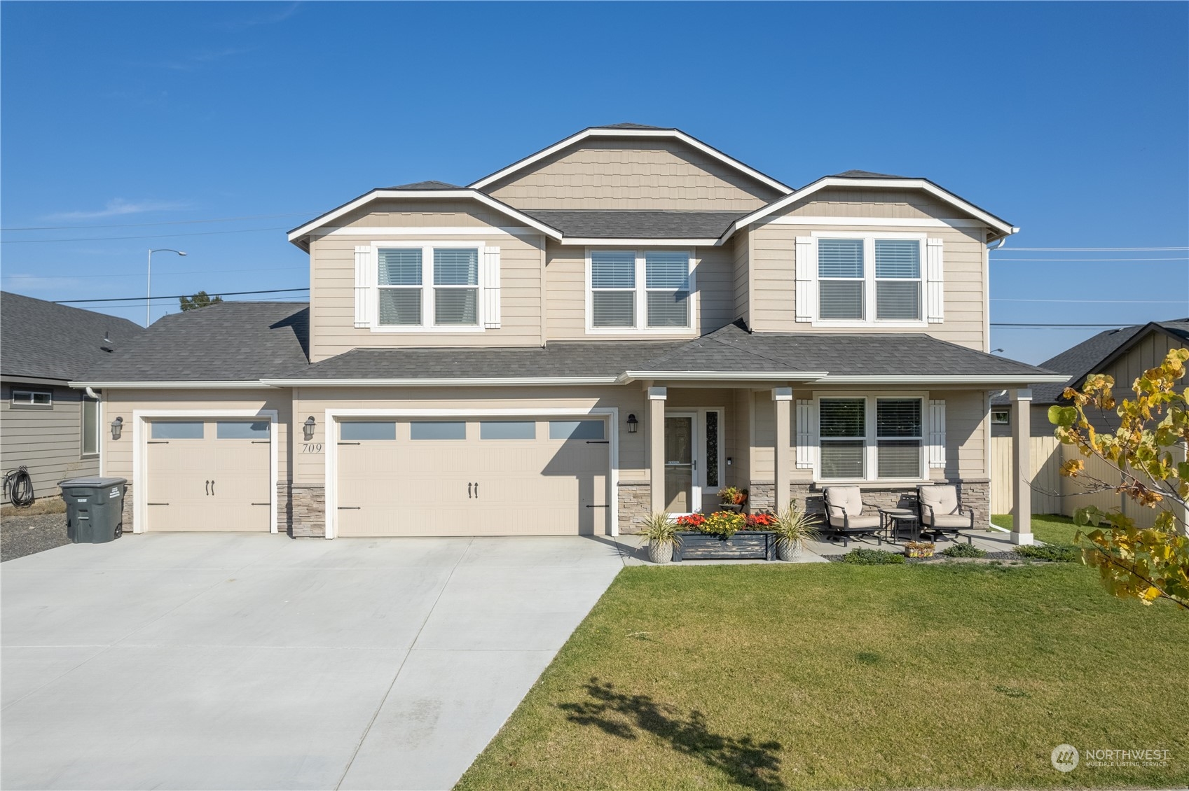 a front view of a house with garden