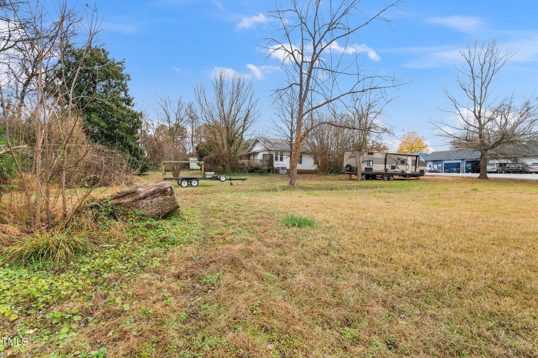 a backyard of apartments with large trees