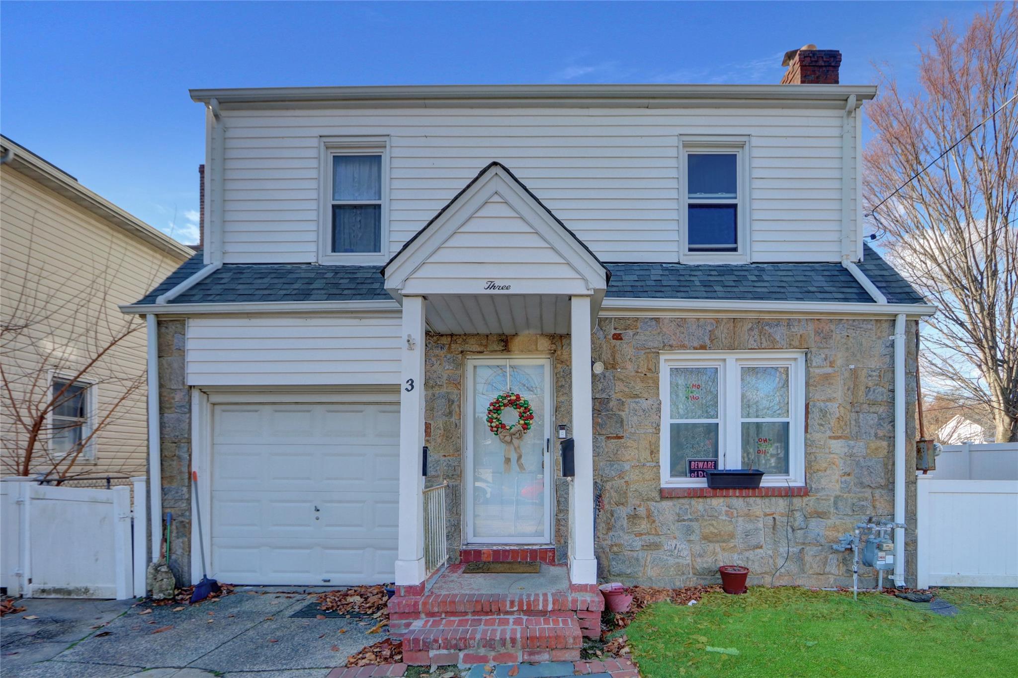 View of front property with a garage