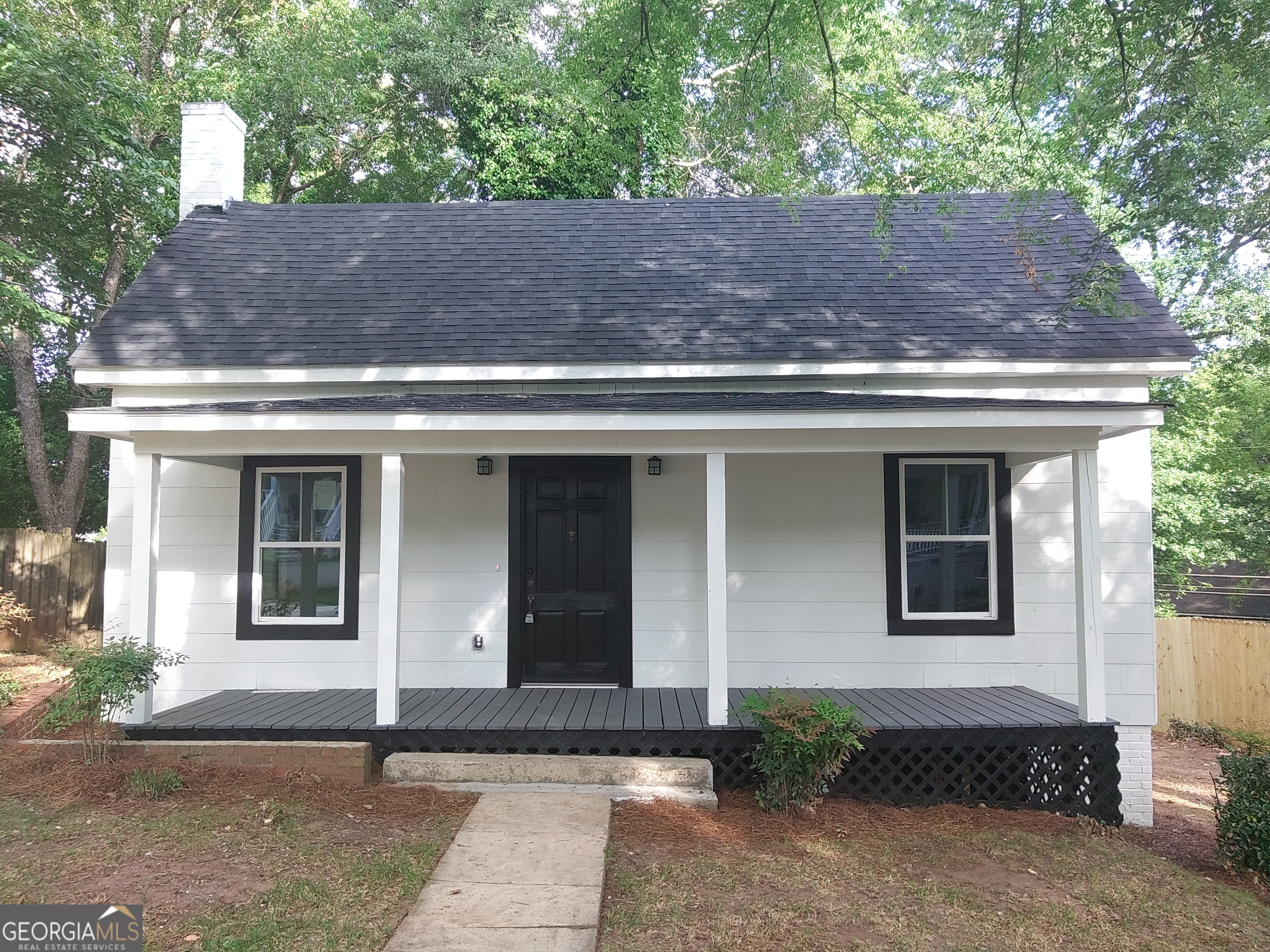 a front view of a house with garage