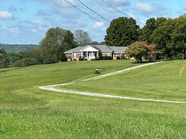 a view of a house with a big yard