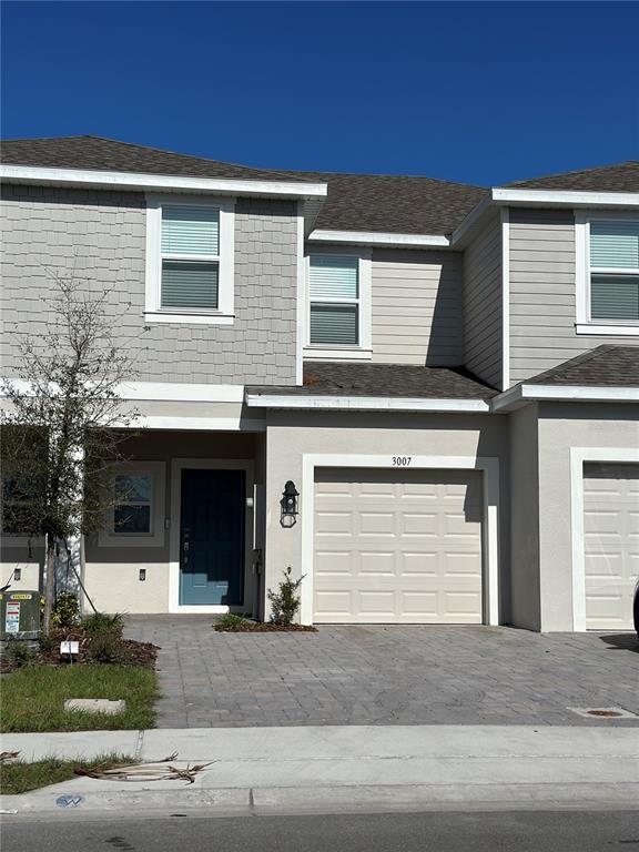 a front view of a house with garage and garage