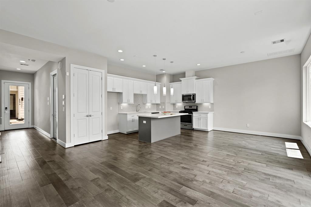 a view of kitchen with wooden floor