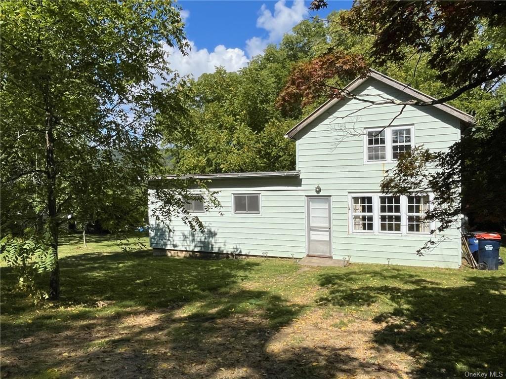 a view of a backyard of the house