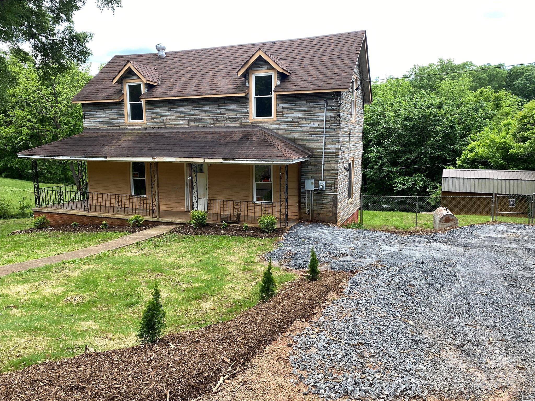 a front view of house with garden